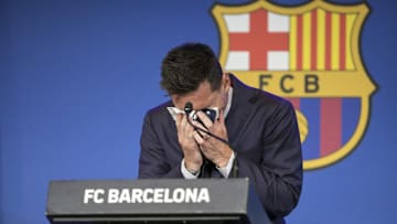 Lionel Messi weeps at a 2021 news conference after FC Barcelona announced it was financially unable to re-sign its greatest player.
