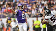 Aug 9, 2025; Minneapolis, Minnesota, USA; Minnesota Vikings quarterback J.J. McCarthy (9) throws a pass as Houston Texans defensive end Solomon Byrd (50) pursues during the first quarter at U.S. Bank Stadium.