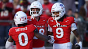 Rutgers Scarlet Knights wide receiver Ian Strong (9) celebrates with teammates after a touchdown reception during the second half against the Maryland Terrapins at SHI Stadium. Vincent Carchietta-Imagn Images