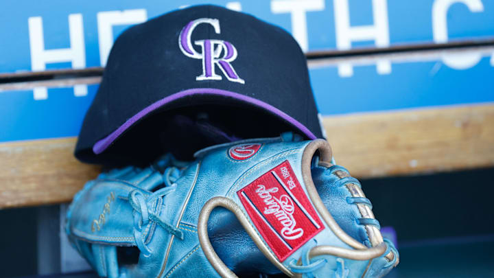Colorado Rockies cap and glove in the dugout during the game against the Detroit Tigers at Comerica Park. Colorado Rockies cap and glove in the dugout during the game against the Detroit Tigers at Comerica Park.