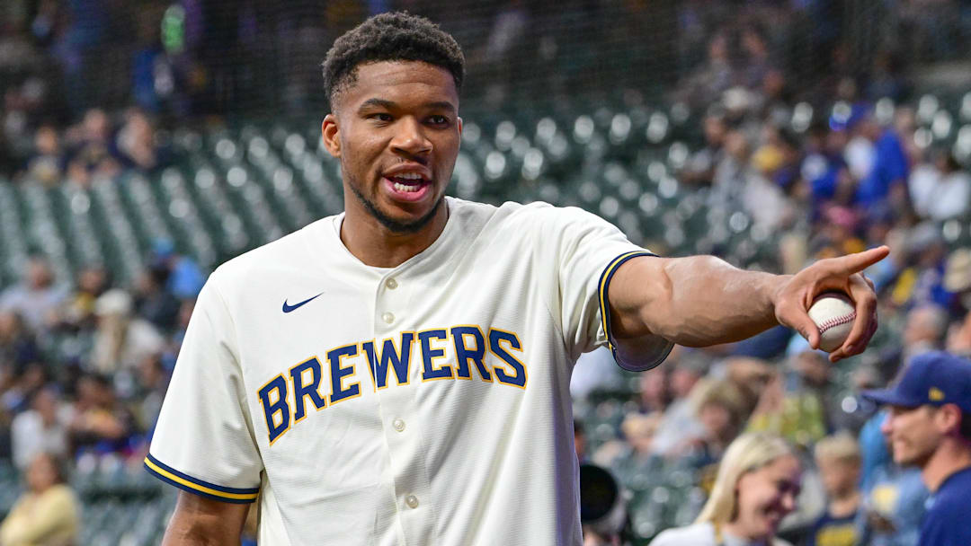 Sep 27, 2024; Milwaukee, Wisconsin, USA; Milwaukee Bucks forward Giannis Antetokounmpo plays catch before game between the Milwaukee Brewers and New York Mets at American Family Field. Mandatory Credit: Benny Sieu-Imagn Images Sep 27, 2024; Milwaukee, Wisconsin, USA; Milwaukee Bucks forward Giannis Antetokounmpo plays catch before game between the Milwaukee Brewers and New York Mets at American Family Field. Mandatory Credit: Benny Sieu-Imagn Images