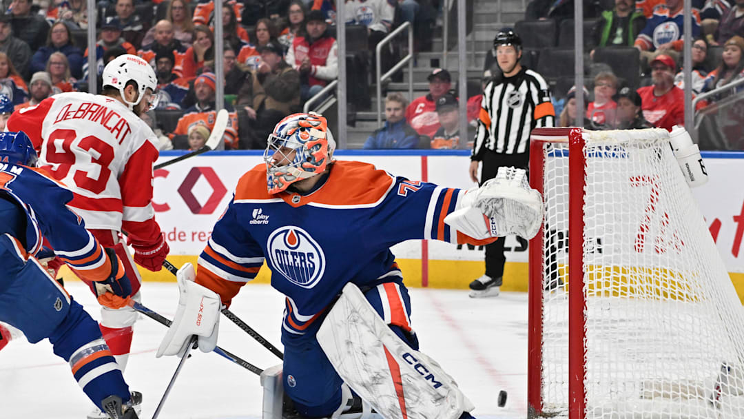 Dec 11, 2025; Edmonton, Alberta, CAN; Edmonton Oilers goalie Stuart Skinner (74) and Detroit Red Wings right winger Alex DeBrincat (93) are seen out on the ice during the second period at Rogers Place. Mandatory Credit: Walter Tychnowicz-Imagn Images