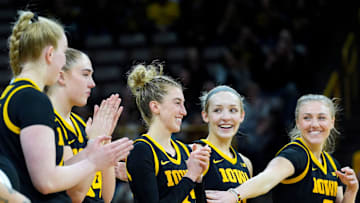 Iowa seniors Addison O'Grady (44), AJ Ediger (34), Lucy Olsen (33), Kylie Feuerbach (4) and Sydney Affolter (3) react during senior recognition after playing Wisconsin Sunday, March 2, 2025 at Carver-Hawkeye Arena in Iowa City, Iowa.