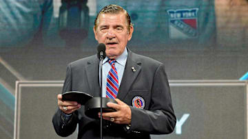 Jul 7, 2022; Montreal, Quebec, CANADA; NHL hall of famer and former Montreal Canadiens player Serge Savard presents the Jim Gregory general manager of the year award to Colorado Avalanche executive vice president and general manager Joe Sakic (not pictured) in the first round of the 2022 NHL Draft at Bell Centre. Mandatory Credit: Eric Bolte-Imagn Images