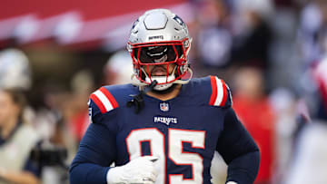 Dec 15, 2024; Glendale, Arizona, USA; New England Patriots defensive tackle Daniel Ekuale (95) against the Arizona Cardinals at State Farm Stadium. Mandatory Credit: Mark J. Rebilas-Imagn Images