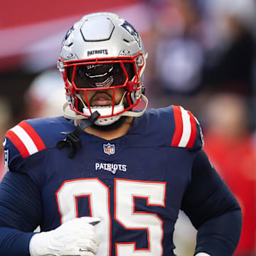 Dec 15, 2024; Glendale, Arizona, USA; New England Patriots defensive tackle Daniel Ekuale (95) against the Arizona Cardinals at State Farm Stadium. Mandatory Credit: Mark J. Rebilas-Imagn Images