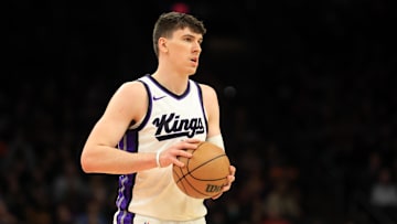 Mar 14, 2025; Phoenix, Arizona, USA; Sacramento Kings forward Jake LaRavia (33) against the Phoenix Suns at Footprint Center. Mandatory Credit: Mark J. Rebilas-Imagn Images
