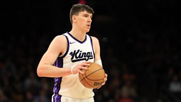 Mar 14, 2025; Phoenix, Arizona, USA; Sacramento Kings forward Jake LaRavia (33) against the Phoenix Suns at Footprint Center. Mandatory Credit: Mark J. Rebilas-Imagn Images