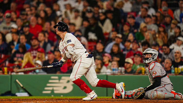 Sep 9, 2024; Boston, Massachusetts, USA; Boston Red Sox designated hitter Tyler O'Neill (17) hits a home run against the Baltimore Orioles in the eighth inning at Fenway Park. Mandatory Credit: David Butler II-Imagn Images