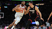 Oct 26, 2025; Miami, Florida, USA; New York Knicks guard Mikal Bridges (25) drives to the basket against Miami Heat forward Jaime Jaquez Jr. (11) during the fourth quarter at Kaseya Center. Mandatory Credit: Sam Navarro-Imagn Images