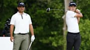Xander Schauffele watches as Collin Morikawa tees off on Saturday.