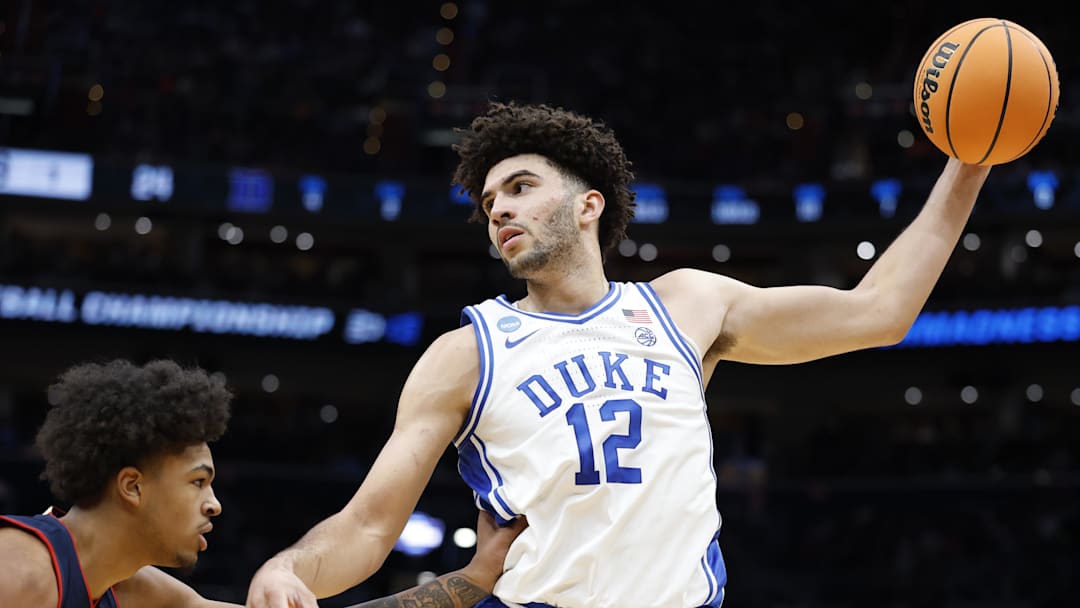 Mar 29, 2026; Washington, DC, USA; Duke Blue Devils forward Cameron Boozer (12) grabs the ball in front of UConn Huskies forward Jaylin Stewart (3) in the first half during an Elite Eight game of the East Regional of the men's 2026 NCAA Tournament at Capital One Arena. Mandatory Credit: Amber Searls-Imagn Images
