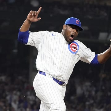 Jun 4, 2024; Chicago, Illinois, USA; Chicago Cubs pitcher Hector Neris (51) reacts after the final out against the Chicago White Sox during the eighth inning at Wrigley Field. 