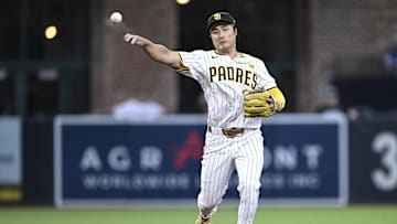 Aug 13, 2024; San Diego, California, USA; San Diego Padres shortstop Ha-Seong Kim (7) throws to first base against the Pittsburgh Pirates during the third inning at Petco Park. Mandatory Credit: Orlando Ramirez-Imagn Images