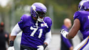 Vikings left tackle Christian Darrisaw practices at TCO Performance Center.