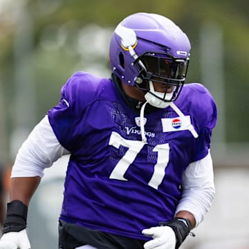 Vikings left tackle Christian Darrisaw practices at TCO Performance Center.