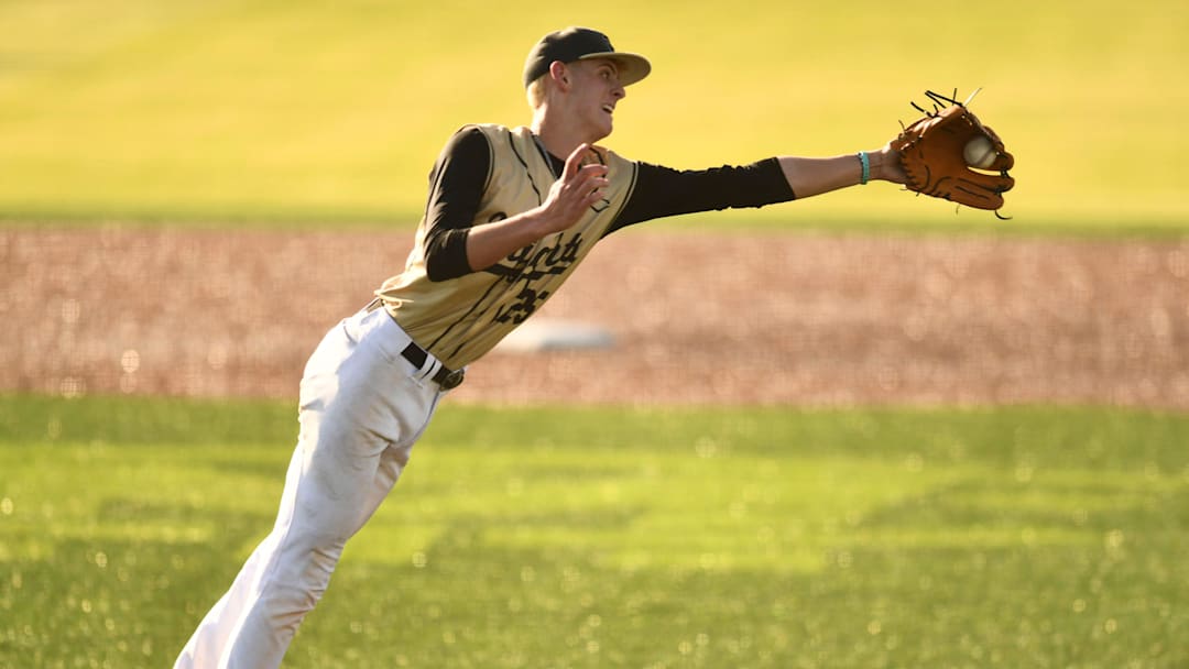 Providence Academy pitcher Josh Owens (25) stops a hit during the Division II Class A TSSAA baseball tournament game against Columbia Academy on Tuesday, May 21, 2024 in Murfreesboro, Tenn.