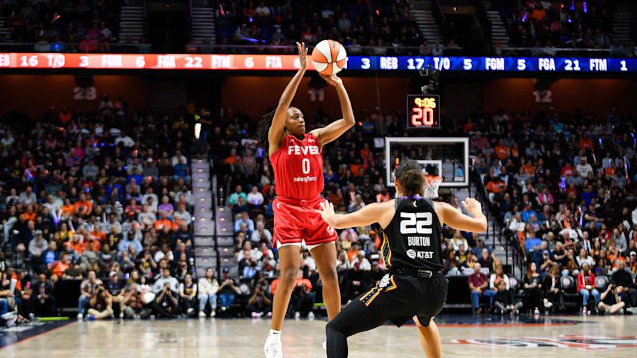 Kelsey Mitchell shoots from three
