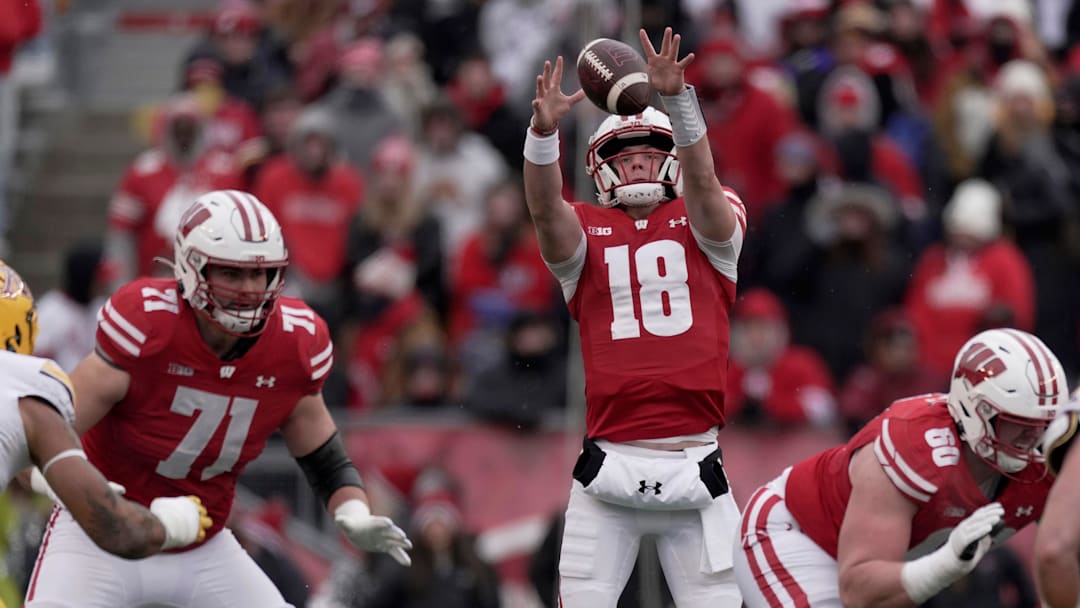 Wisconsin quarterback Braedyn Locke (18) grabs a high snap during the first quarter of their game at Camp Randall Stadium Friday, November 29, 2024 in Madison, Wisconsin. Minnesota beat Wisconsin 24-7.