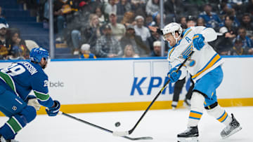 Oct 13, 2025; Vancouver, British Columbia, CAN; Vancouver Canucks defenseman Marcus Pettersson (29) stick checks St. Louis Blues forward Robert Thomas (18) in the third period at Rogers Arena. Mandatory Credit: Bob Frid-Imagn Images