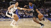 Dec 3, 2025; Orlando, Florida, USA; Orlando Magic guard Jase Richardson (11) moves the ball past San Antonio Spurs forward Carter Bryant (11) in the third quarter at Kia Center. Mandatory Credit: Nathan Ray Seebeck-Imagn Images