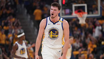 Apr 15, 2025; San Francisco, California, USA; Golden State Warriors center Quinten Post (21) reacts after making a three point basket against the Memphis Grizzlies in the second quarter at the Chase Center. Mandatory Credit: Cary Edmondson-Imagn Images