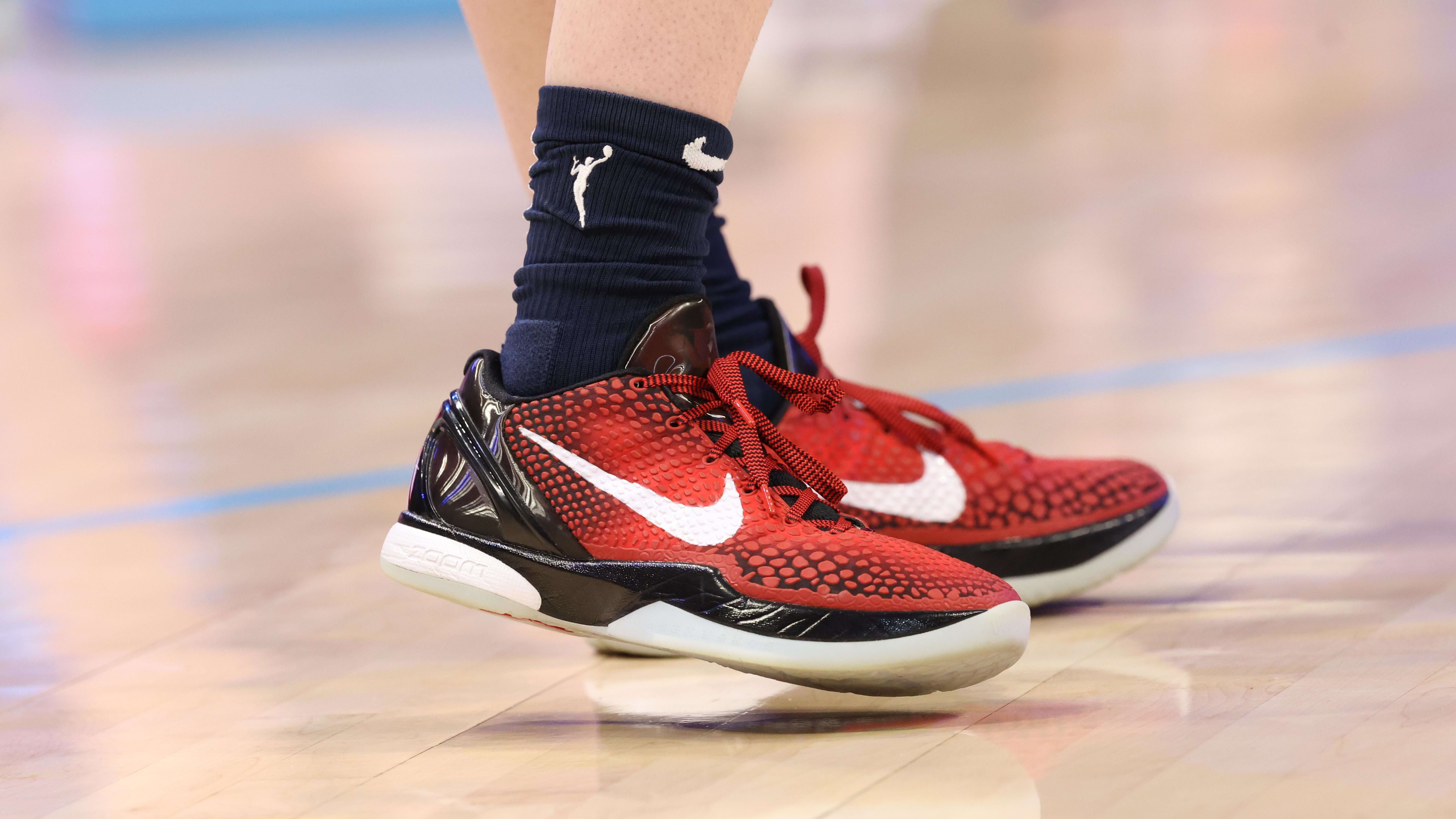 Indiana Fever guard Caitlin Clark's red and black Nike sneakers.