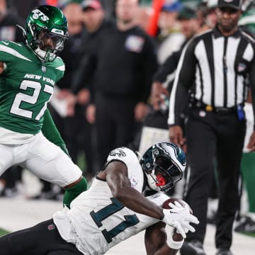 Oct 15, 2023; East Rutherford, New Jersey, USA; Philadelphia Eagles wide receiver A.J. Brown (11) catches the ball as New York Jets cornerback Tae Hayes (27) defends during the second half at MetLife Stadium