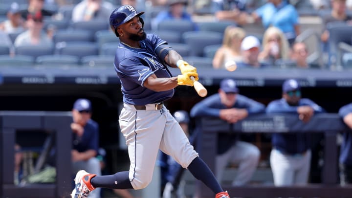 Jul 20, 2024; Bronx, New York, USA; Tampa Bay Rays left fielder Randy Arozarena (56) hits a two run home run against the New York Yankees during the seventh inning at Yankee Stadium. Mandatory Credit: Brad Penner-USA TODAY Sports