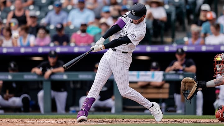 Jul 20, 2025; Denver, Colorado, USA; Colorado Rockies third baseman Ryan McMahon (24) hits a double in the seventh inning against the Minnesota Twins at Coors Field. Jul 20, 2025; Denver, Colorado, USA; Colorado Rockies third baseman Ryan McMahon (24) hits a double in the seventh inning against the Minnesota Twins at Coors Field.