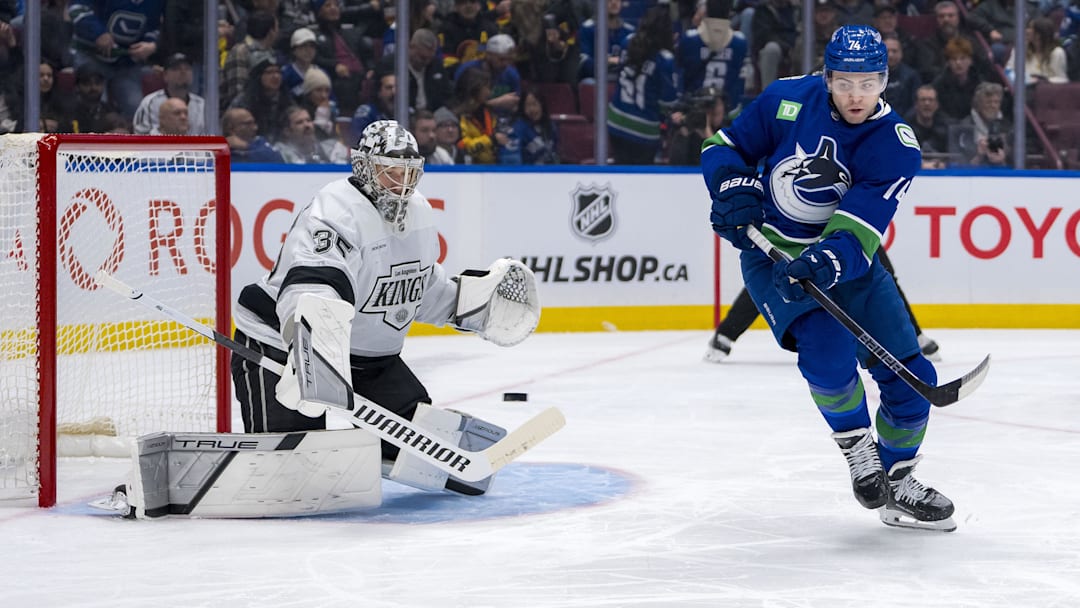 Jan 16, 2025; Vancouver, British Columbia, CAN; Vancouver Canucks forward Jake DeBrusk (74) redirects a shot towards Los Angeles Kings goalie Darcy Kuemper (35) in the second period at Rogers Arena. Mandatory Credit: Bob Frid-Imagn Images
