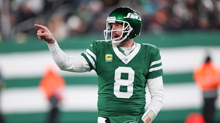 New York Jets quarterback Aaron Rodgers (8) gestures towards the Miami Dolphins bench during the second half at MetLife Stadium. New York Jets quarterback Aaron Rodgers (8) gestures towards the Miami Dolphins bench during the second half at MetLife Stadium.
