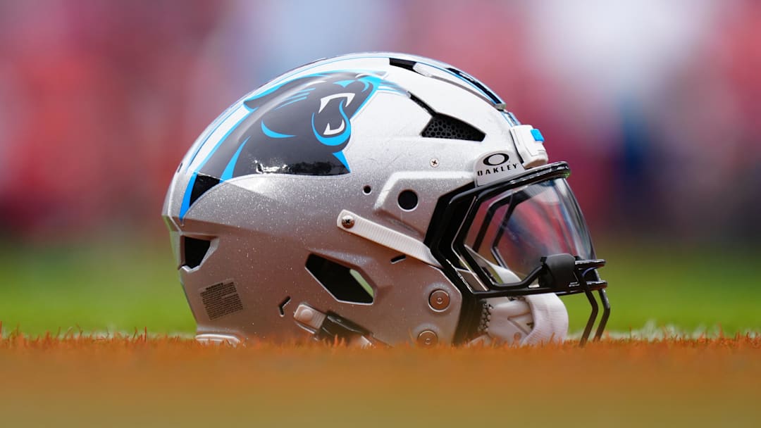 Oct 27, 2024; Denver, Colorado, USA; Detailed view of a Carolina Panthers helmet on the turf at Empower Field before the game against the Denver Broncos at Mile High. Mandatory Credit: Ron Chenoy-Imagn Images