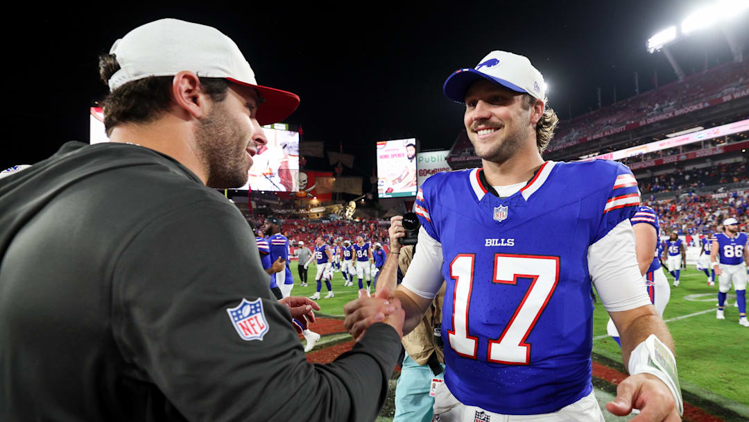 Aug 23, 2025; Tampa, Florida, USA; Buffalo Bills quarterback Josh Allen (17) greets Tampa Bay Buccaneers quarterback Baker Mayfield (6) after a preseason game at Raymond James Stadium.