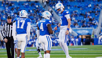 Nov 16, 2024; Lexington, Kentucky, USA; Kentucky Wildcats quarterback Cutter Boley (8) celebrates with running back Chip Trayanum (4) after carrying the ball for a first down during the third quarter against the Murray State Racers at Kroger Field. Mandatory Credit: Jordan Prather-Imagn Images