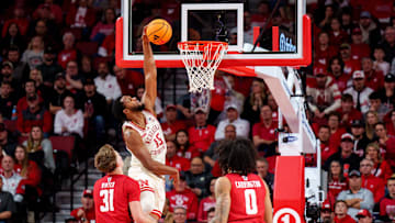 Dec 10, 2025; Lincoln, Nebraska, USA; Nebraska Cornhuskers forward Jared Garcia (15) shoots the ball against Wisconsin Badgers forward Nolan Winter (31) and forward Braeden Carrington (0) during the second half at Pinnacle Bank Arena. 