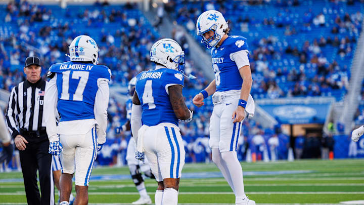 Nov 16, 2024; Lexington, Kentucky, USA; Kentucky Wildcats quarterback Cutter Boley (8) celebrates with running back Chip Trayanum (4) after carrying the ball for a first down during the third quarter against the Murray State Racers at Kroger Field. Mandatory Credit: Jordan Prather-Imagn Images