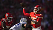 Nov 23, 2025; Kansas City, Missouri, USA; Kansas City Chiefs quarterback Patrick Mahomes (15) throws a pass against Indianapolis Colts defensive end Laiatu Latu (97) in the first half at GEHA Field at Arrowhead Stadium. Mandatory Credit: Jay Biggerstaff-Imagn Images