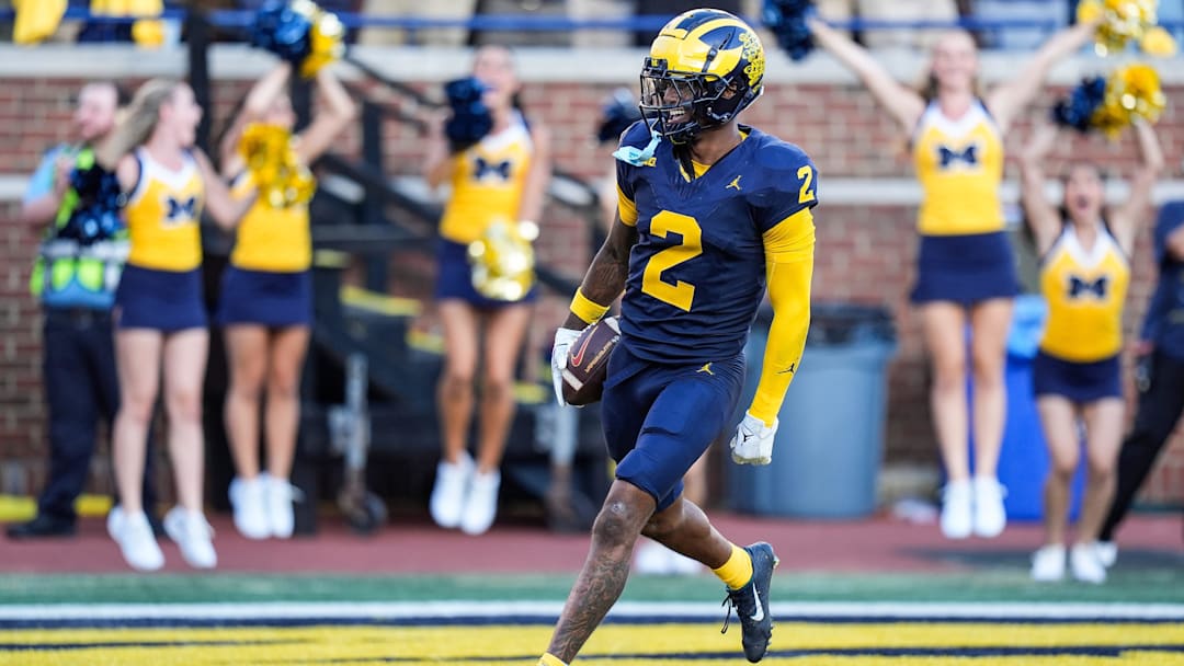 Michigan defensive back Will Johnson celebrates a touchdown after intercepting USC quarterback Miller Moss during the second half at Michigan Stadium in Ann Arbor on Saturday, Sept. 21, 2024.