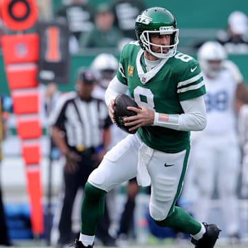 Nov 17, 2024; East Rutherford, New Jersey, USA; New York Jets quarterback Aaron Rodgers (8) drops back to pass against the Indianapolis Colts during the first quarter at MetLife Stadium. Mandatory Credit: Brad Penner-Imagn Images