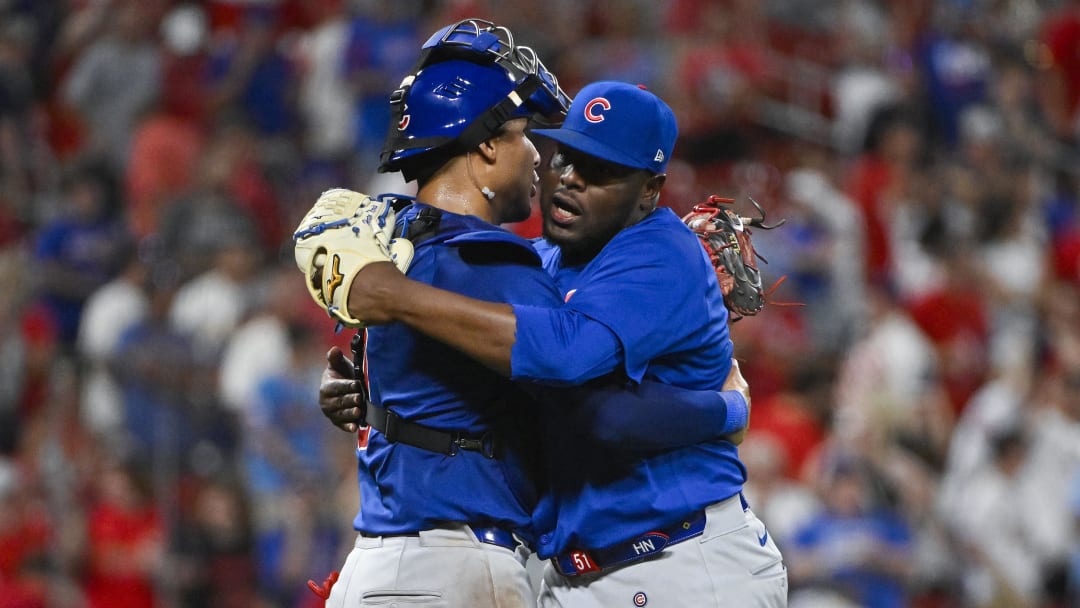 Jul 12, 2024; St. Louis, Missouri, USA;  Chicago Cubs relief pitcher Hector Neris (51) celebrates catcher Miguel Amaya (9) after the Cubs defeated the St. Louis Cardinals at Busch Stadium.