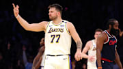 Mar 2, 2025; Los Angeles, California, USA; Los Angeles Lakers guard Luka Doncic (77) reacts to a play during the third quarter against the LA Clippers at Crypto.com Arena. Mandatory Credit: Jason Parkhurst-Imagn Images