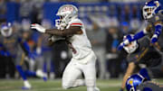 Nov 22, 2024; San Jose, California, USA; UNLV Rebels running back Jai'Den Thomas (9) looks for running room against the San Jose State Spartans during the second quarter at CEFCU Stadium. Mandatory Credit: D. Ross Cameron-Imagn Images