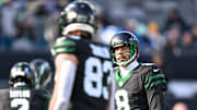 Dec 1, 2024; East Rutherford, New Jersey, USA; New York Jets quarterback Aaron Rodgers (8) warms up with tight end Tyler Conklin (83) before the game against the Seattle Seahawks at MetLife Stadium. Mandatory Credit: Mark Smith-Imagn Images