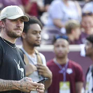 Sep 16, 2023; College Station, Texas, USA; Former Texas A&M Aggies player Johnny Manziel watches from the sideline during the first half of the game between the Aggies and the Louisiana Monroe Warhawks at Kyle Field. Mandatory Credit: Troy Taormina-Imagn Images