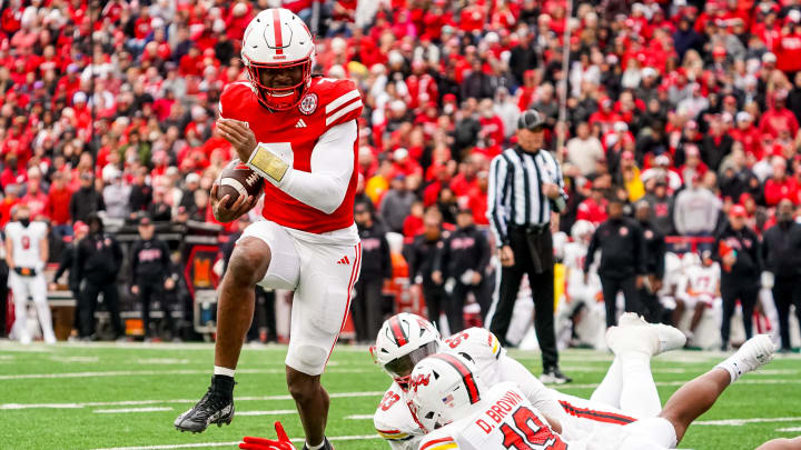 Nov 11, 2023; Lincoln, Nebraska, USA; Nebraska Cornhuskers quarterback Jeff Sims (7) runs against Maryland Terrapins defensive lineman Donnell Brown (19) during the third quarter at Memorial Stadium.