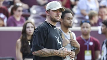 Sep 16, 2023; College Station, Texas, USA; Former Texas A&M Aggies player Johnny Manziel watches from the sideline during the first half of the game between the Aggies and the Louisiana Monroe Warhawks at Kyle Field. Mandatory Credit: Troy Taormina-Imagn Images