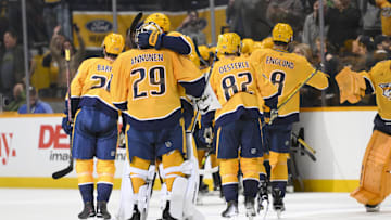 Apr 8, 2025; Nashville, Tennessee, USA;  Nashville Predators center Fedor Svechkiv (40) celebrates his game=winning goal with his teammates  during the over time period at Bridgestone Arena. Mandatory Credit: Steve Roberts-Imagn Images