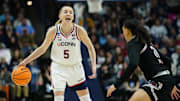 Mar 22, 2025; Storrs, Connecticut, USA; UConn Huskies guard Paige Bueckers (5) looks for an opening against the Arkansas State Red Wolves in the first half at Harry A. Gampel Pavilion. Mandatory Credit: David Butler II-Imagn Images