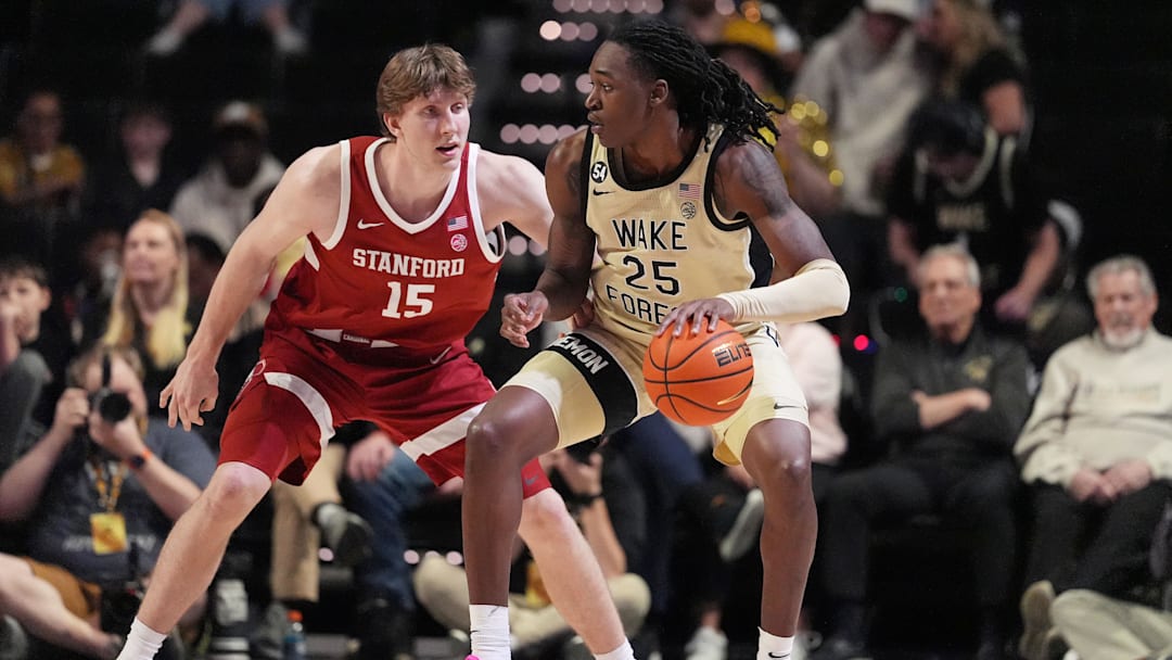 Feb 14, 2026; Winston-Salem, North Carolina, USA;  Wake Forest Demon Deacons forward Tre'von Spillers (25) handles the ball defended by Stanford Cardinal forward Oskar Giltay (15) during the second half at Lawrence Joel Veterans Memorial Coliseum. Mandatory Credit: Jim Dedmon-Imagn Images